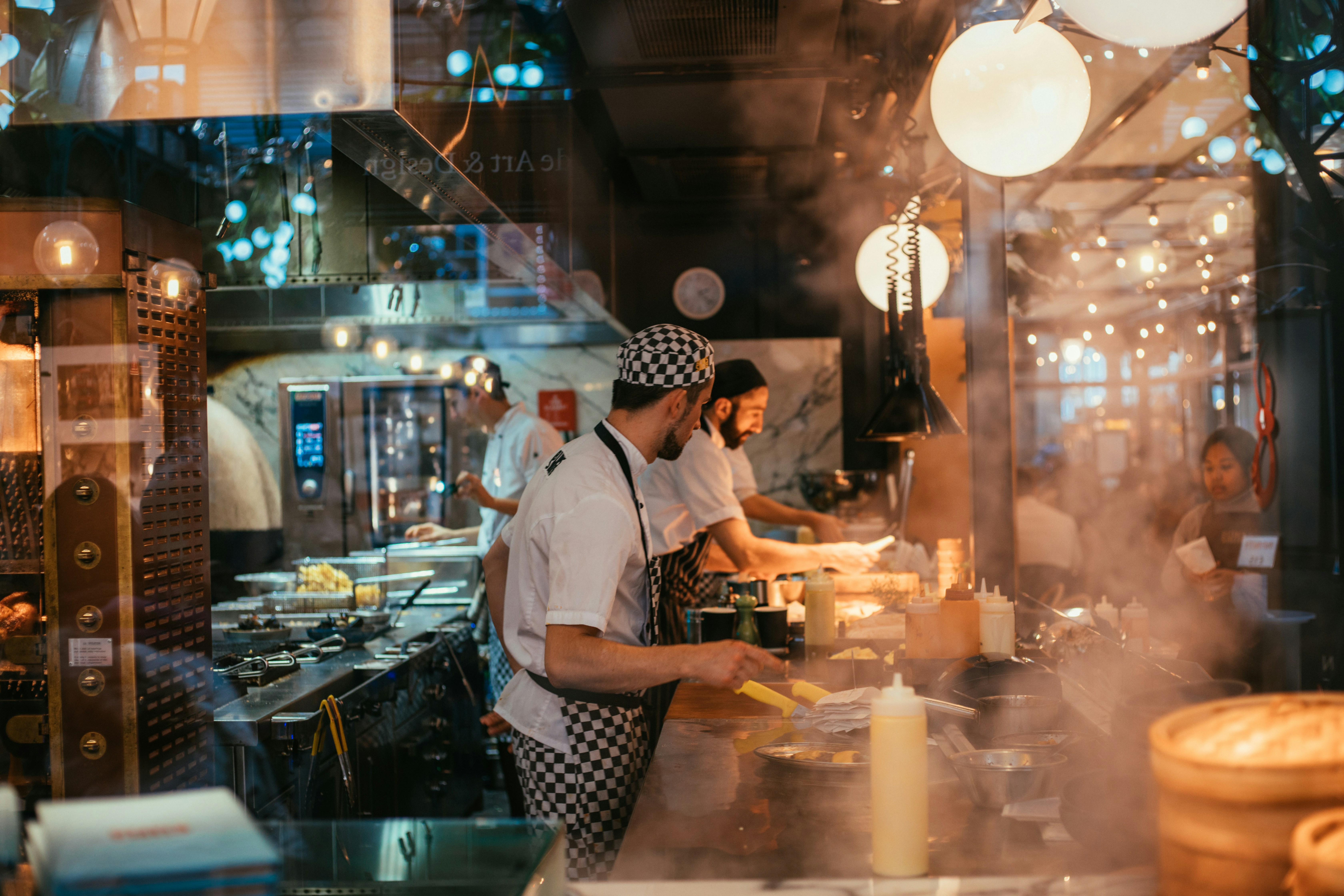 Chefs working in a busy open kitchen