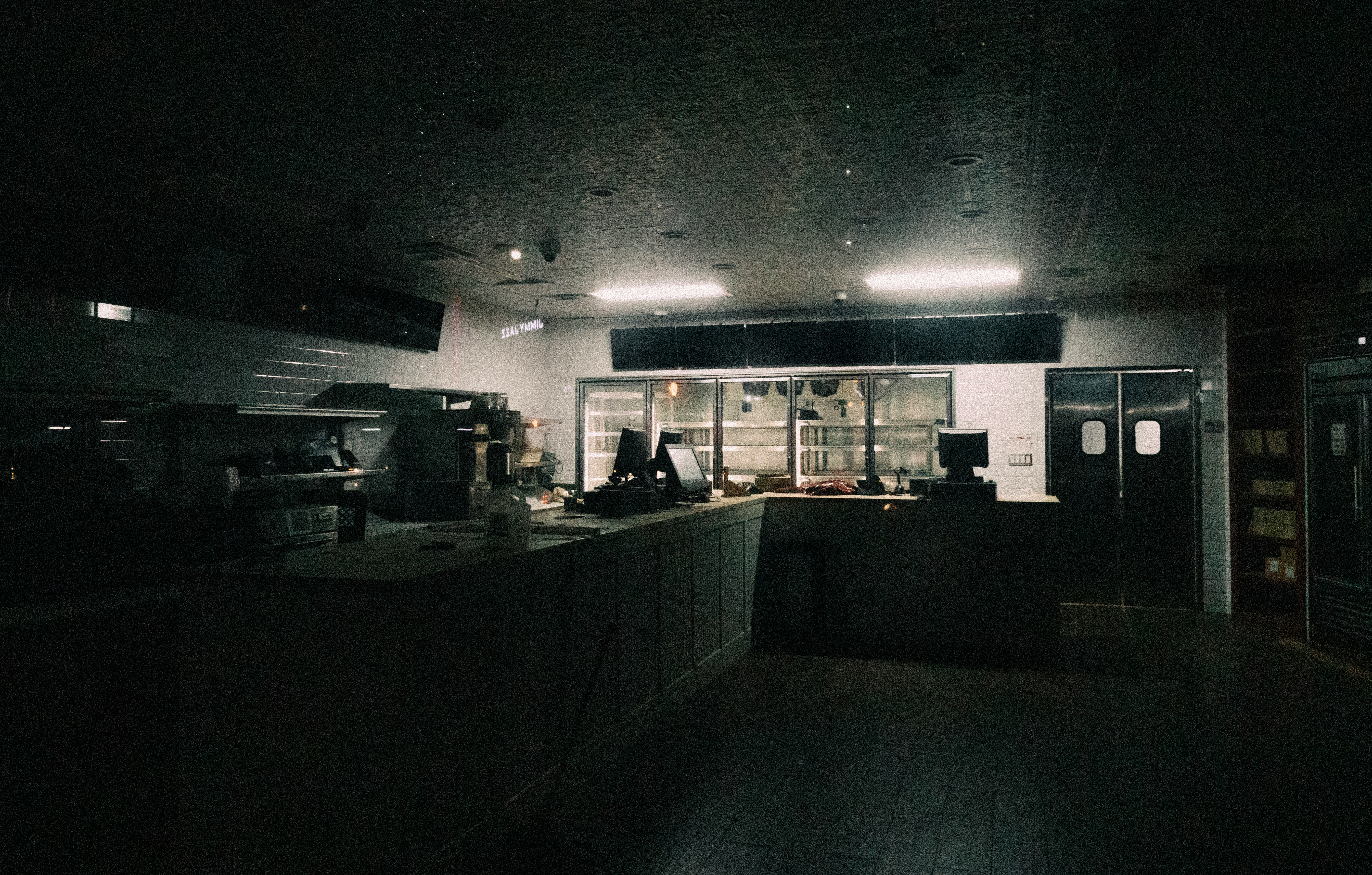 Quiet restaurant kitchen with tile floors and work stations