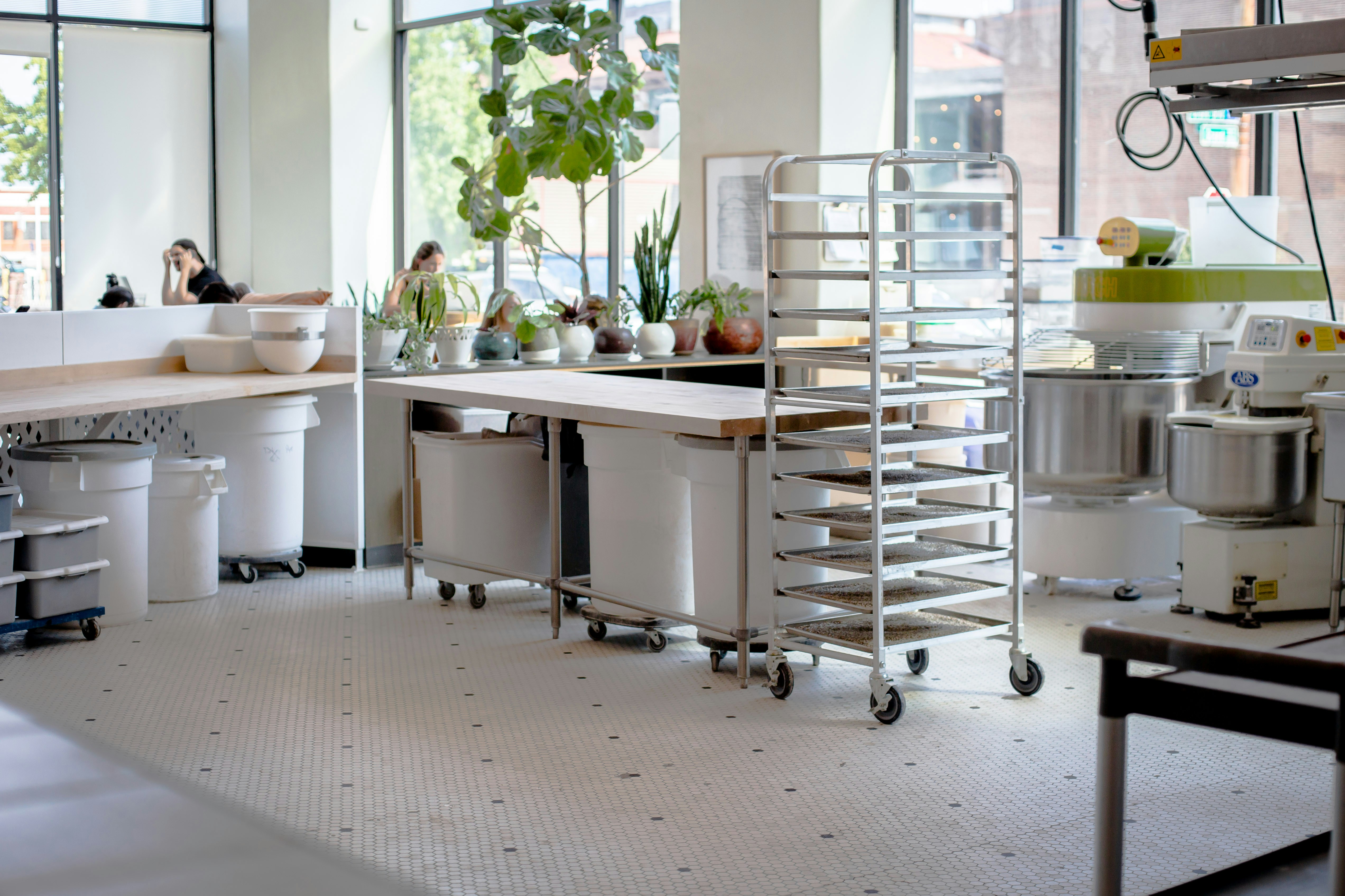 Bright commercial kitchen prep area with tile floor