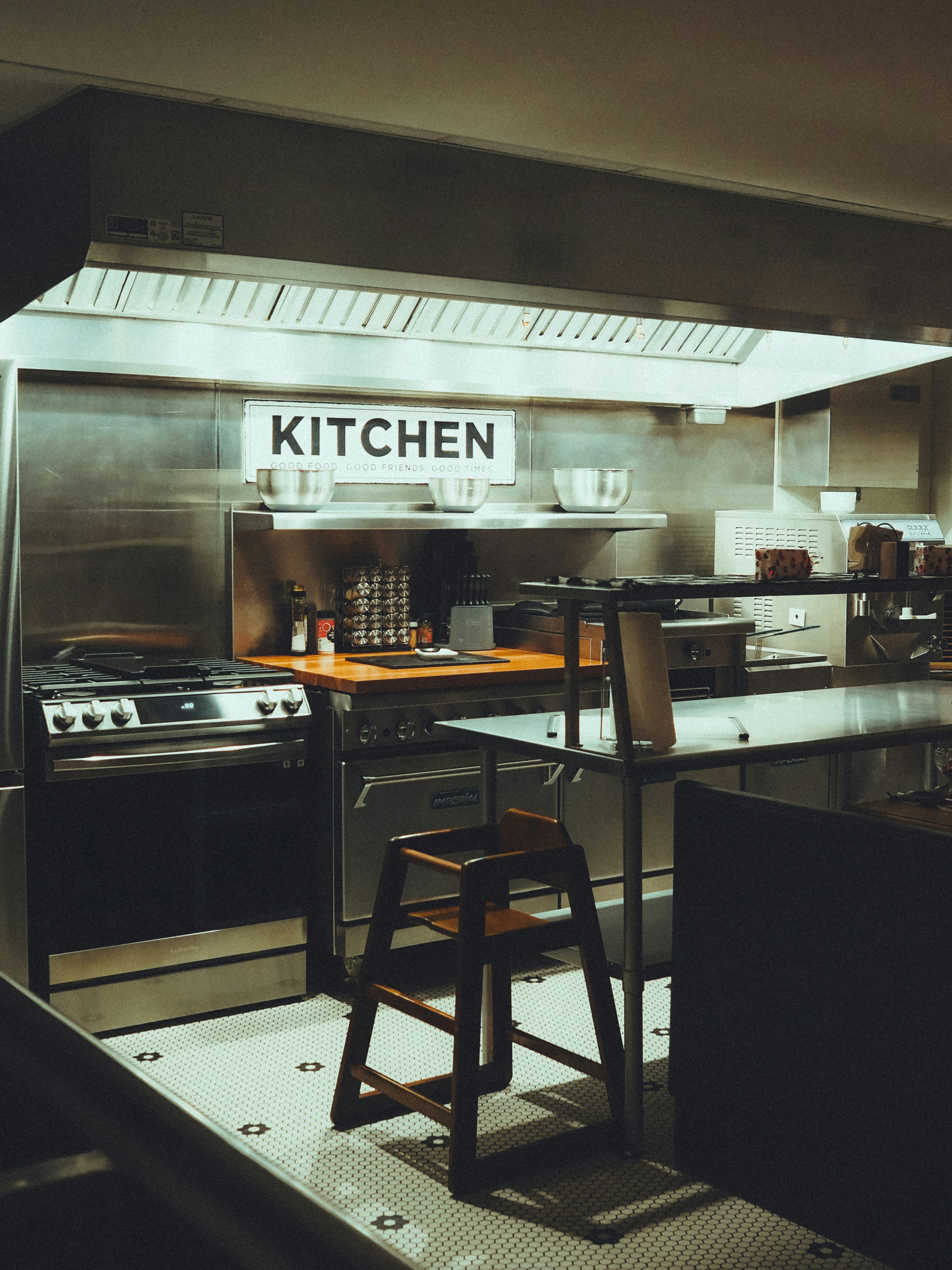 Commercial kitchen station with stainless steel surfaces
